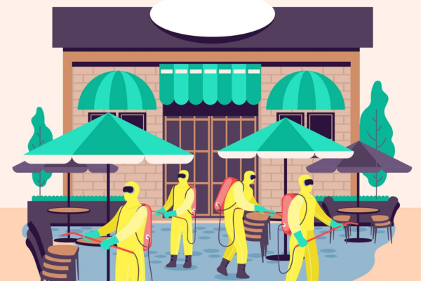 Agent PN Line effectuant le nettoyage d'une cuisine professionnelle dans un restaurant à Paris.